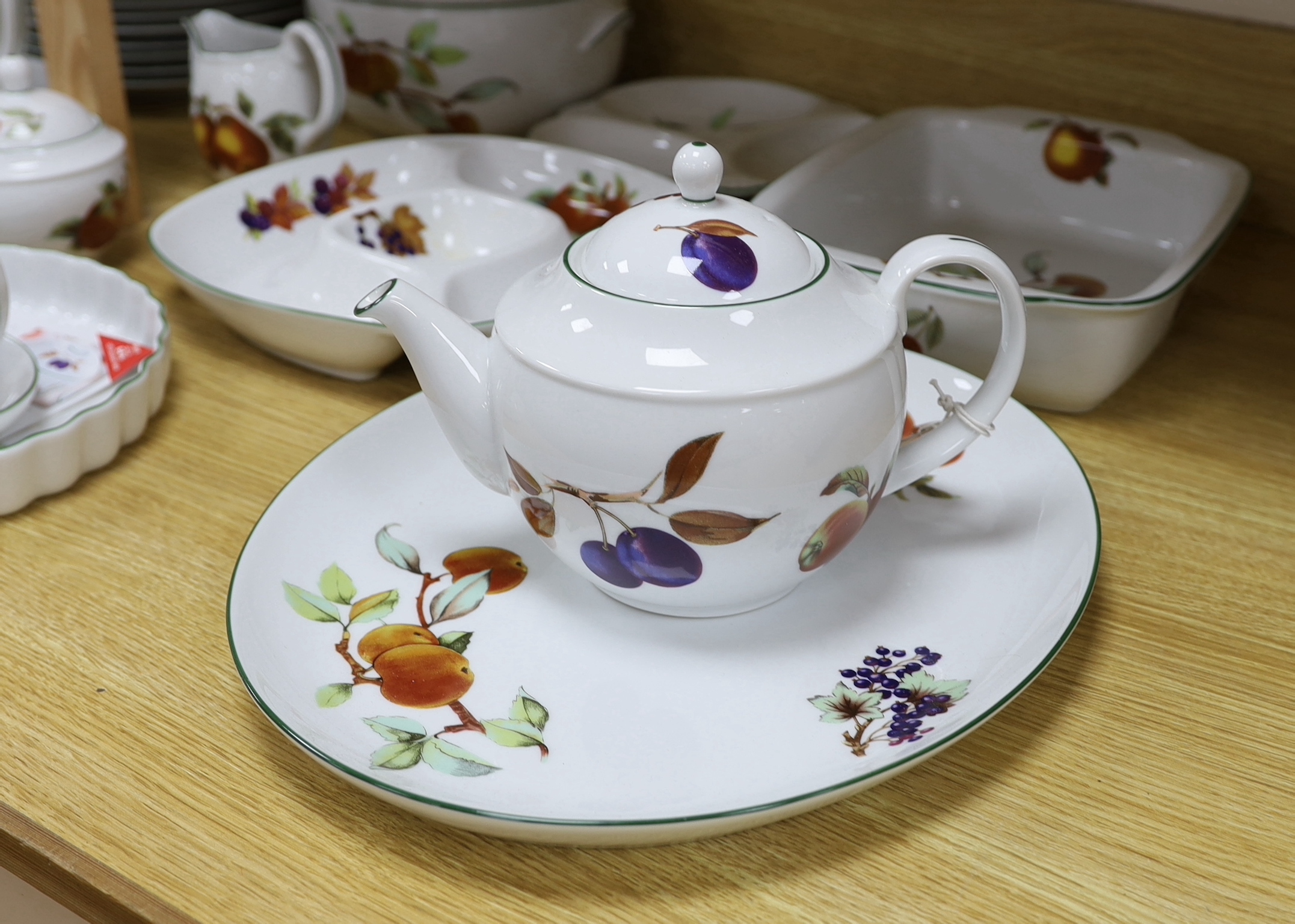 A large quantity of Royal Worcester Evesham Vale serving dishes and dinnerwares